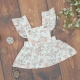 Sukienka niemowlęca na szelkach, subtelne różyczki